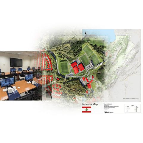 Three young professionals in a discussion while working on a laptop